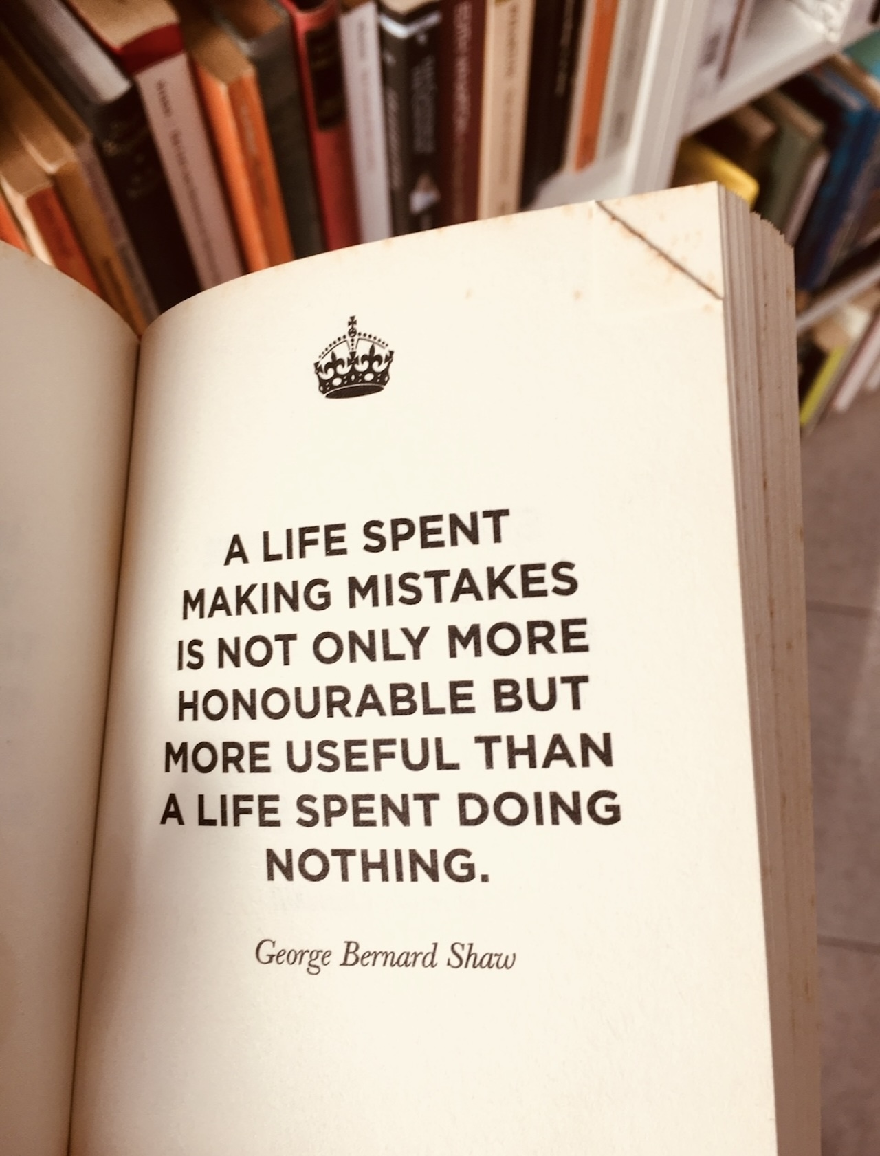 Open book with a quote by George Bernard Shaw about mistakes
