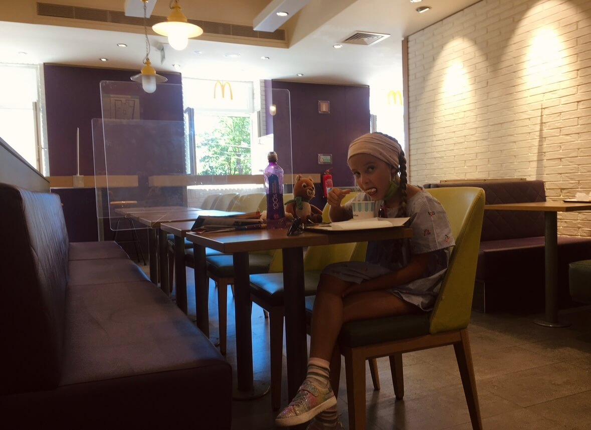 Empty McDonald's interior in Lisbon, offering a quiet and anonymous space with Wi-Fi for remote work.