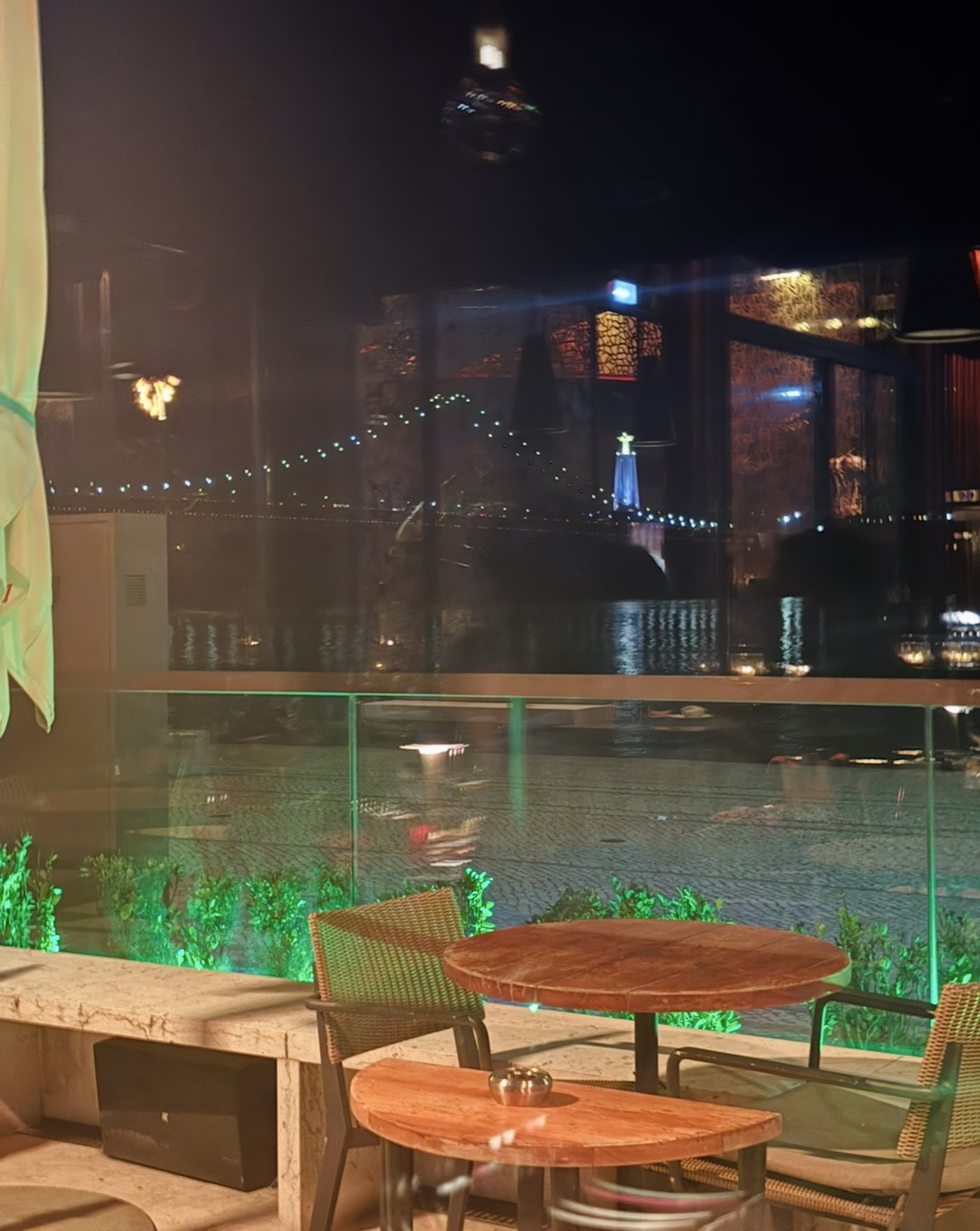 Night view from Sud Lisboa during a solo date in Lisbon with music and river views
